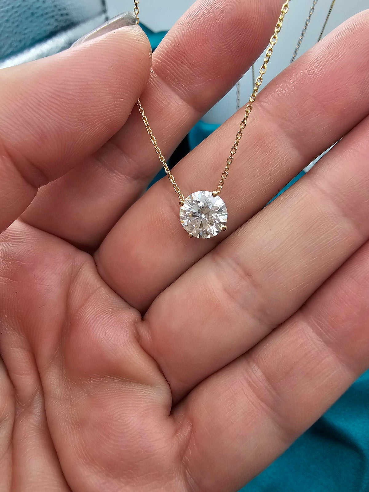 2 carat round Moissanite necklace I'm 14k yellow gold on 14k chain