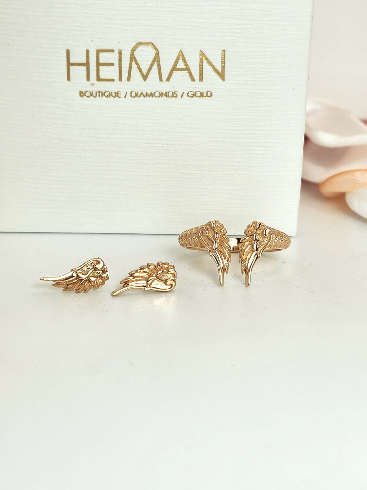 Wing stud earrings 14k rose gold.