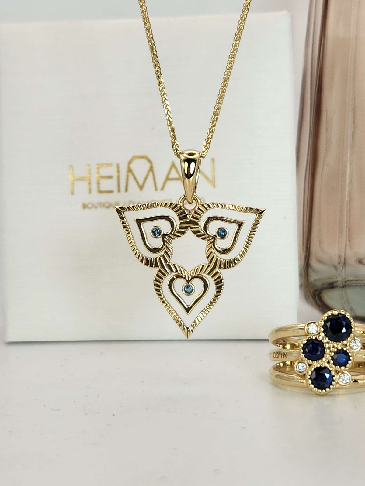 heart necklace 14k gold set with blue topaz comes on a 14k yellow chain