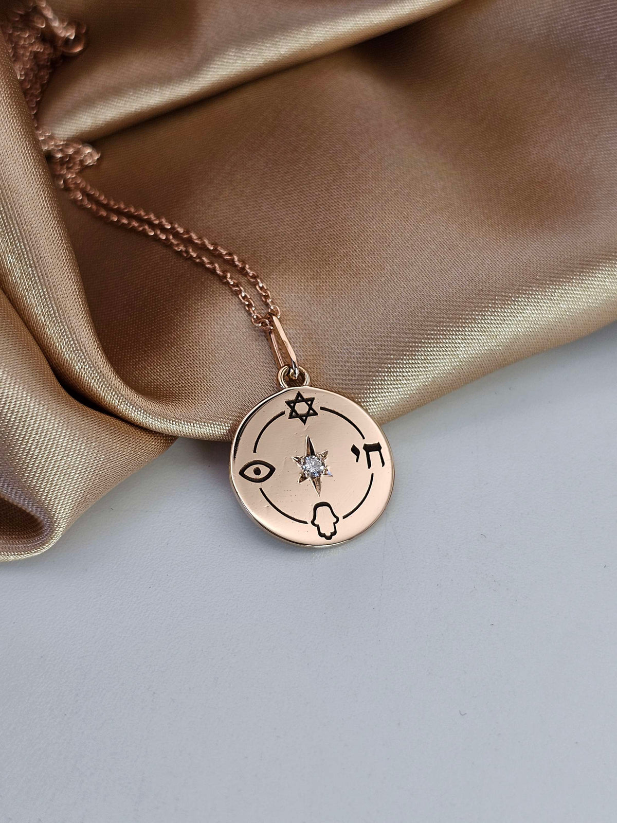 Small "Jewish compas" necklace, 14k gold set with natural diamond.