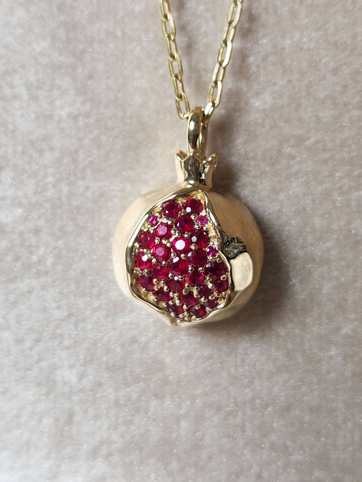Large 20mm pomegranate in 14k gold set with natural ruby's