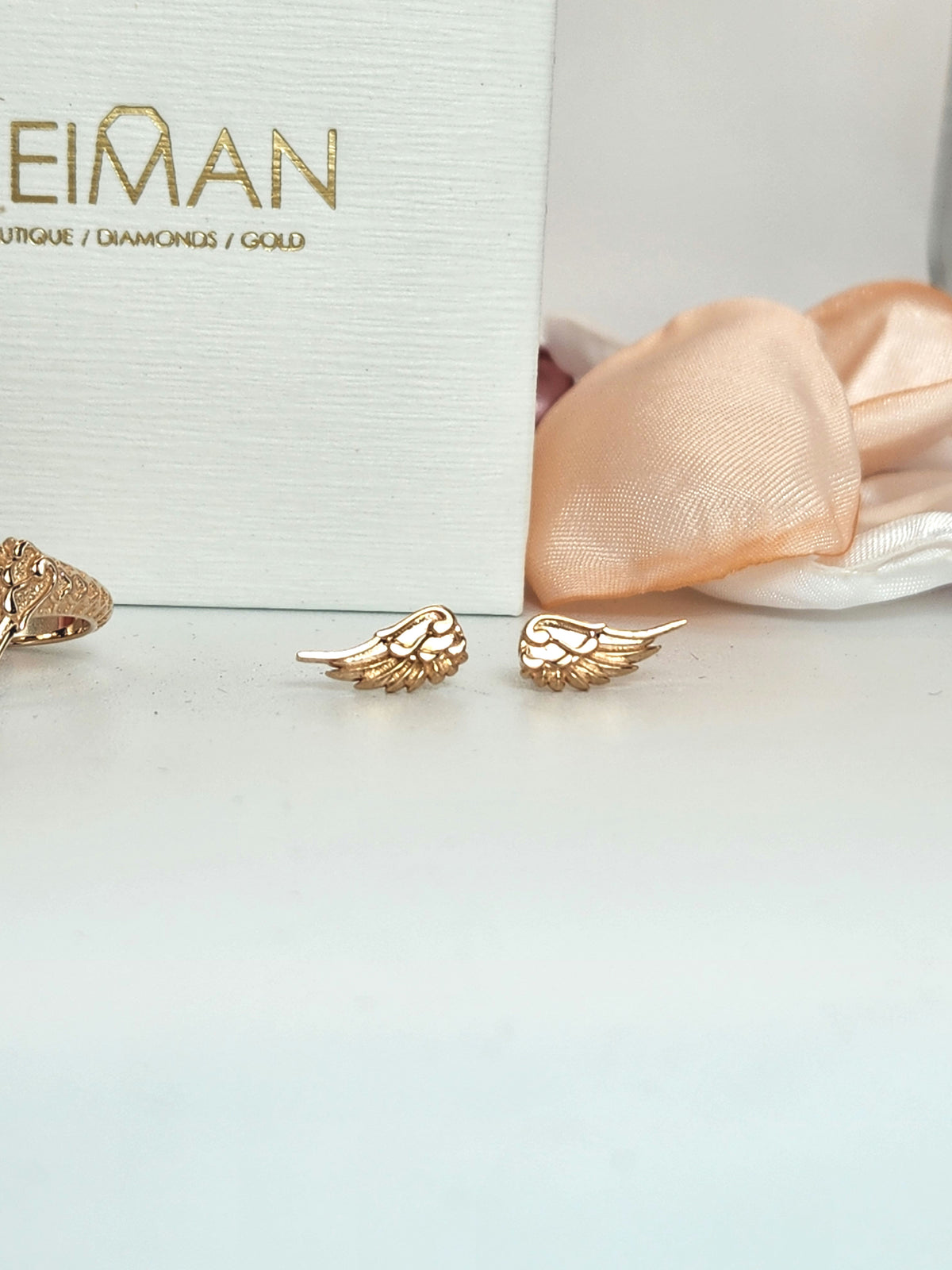 Wing stud earrings 14k rose gold.