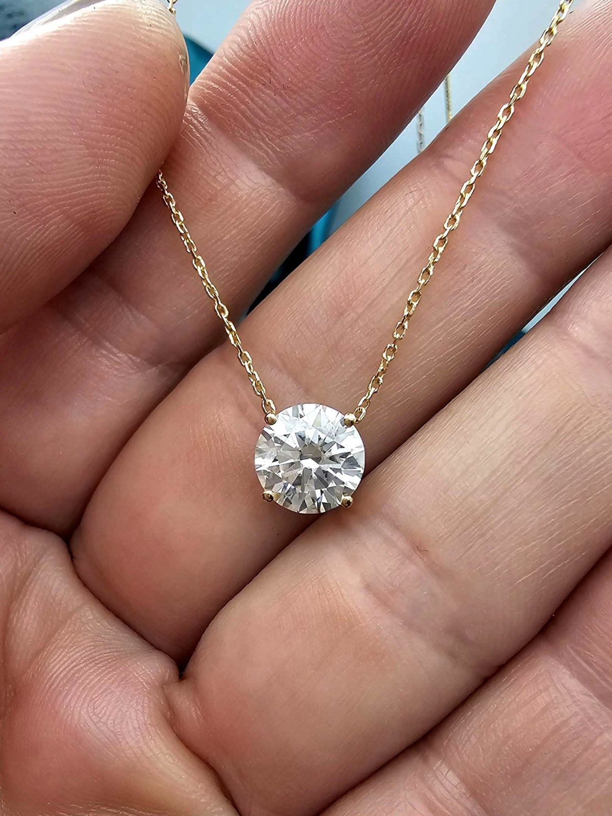 2 carat round Moissanite necklace I'm 14k yellow gold on 14k chain