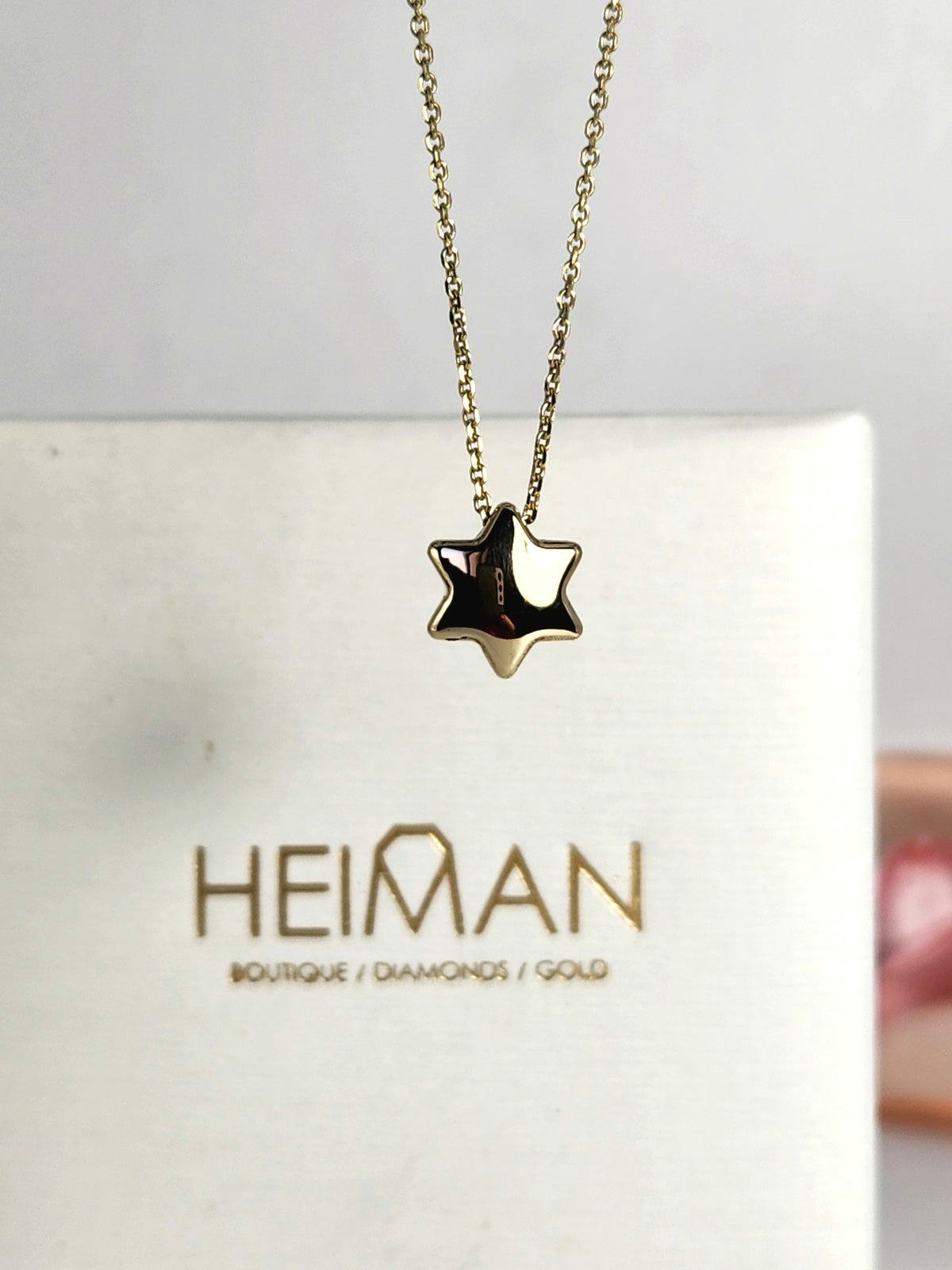 Bubble Star david necklace comes on 18 inch 14k chain.