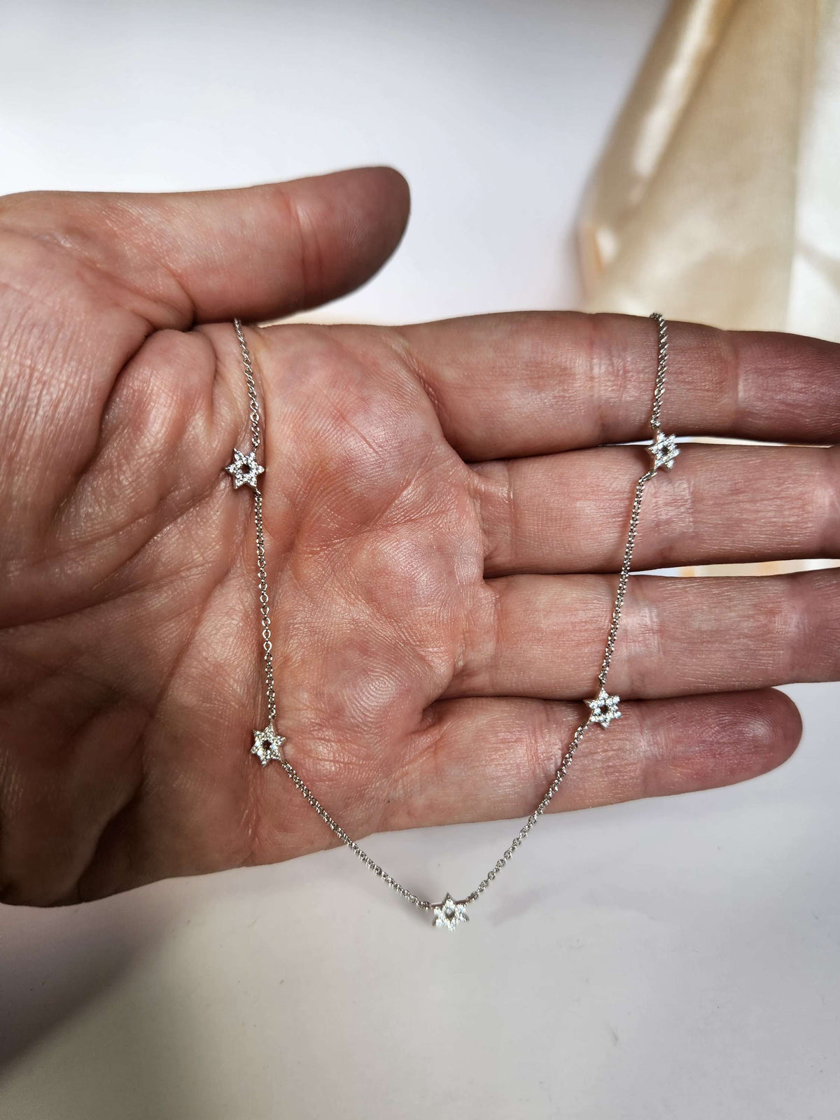 Five star of David necklace 14k gold set with diamonds.