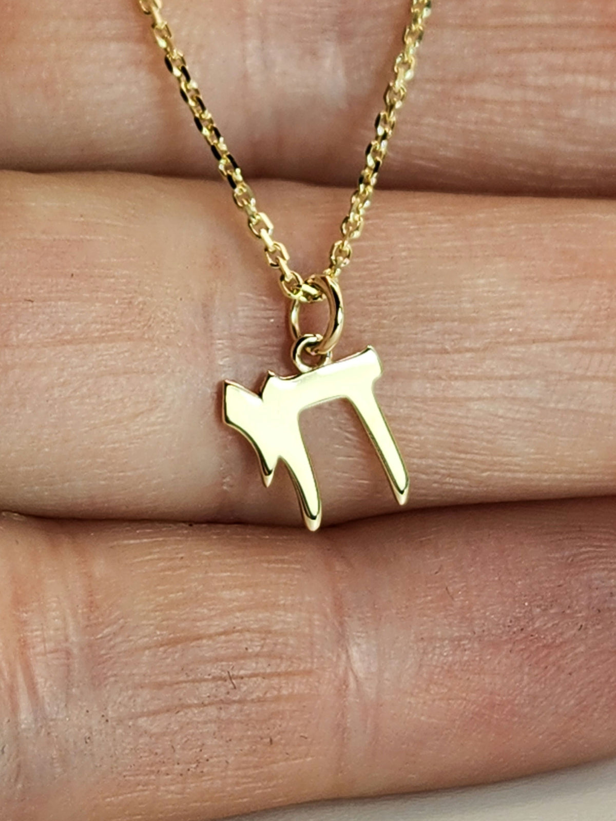 Chai pendant necklace worn on neck